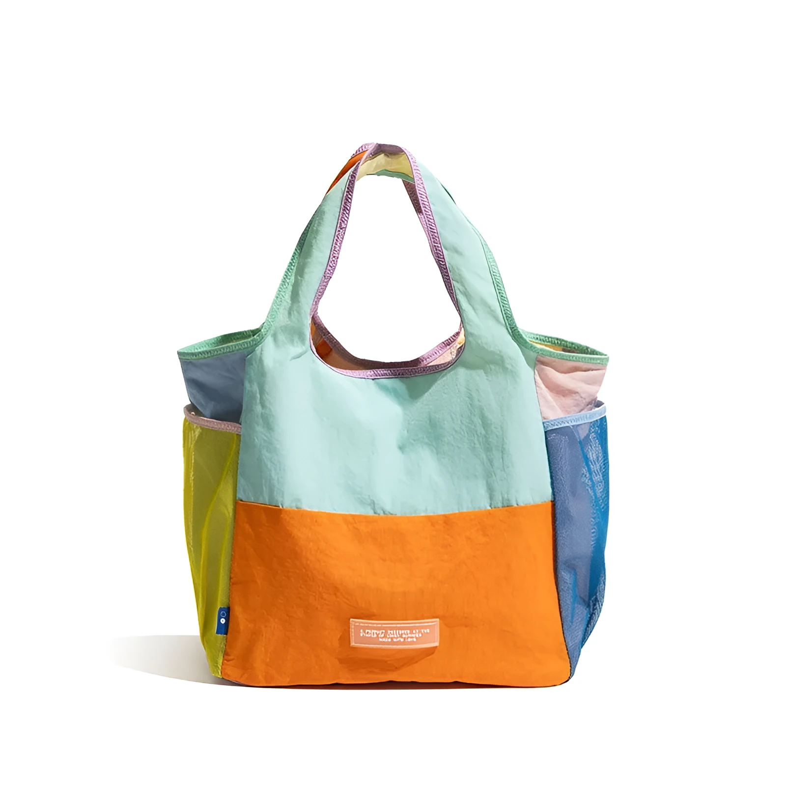 Foldable canvas tote bag in orange with crossbody strap, polyester material