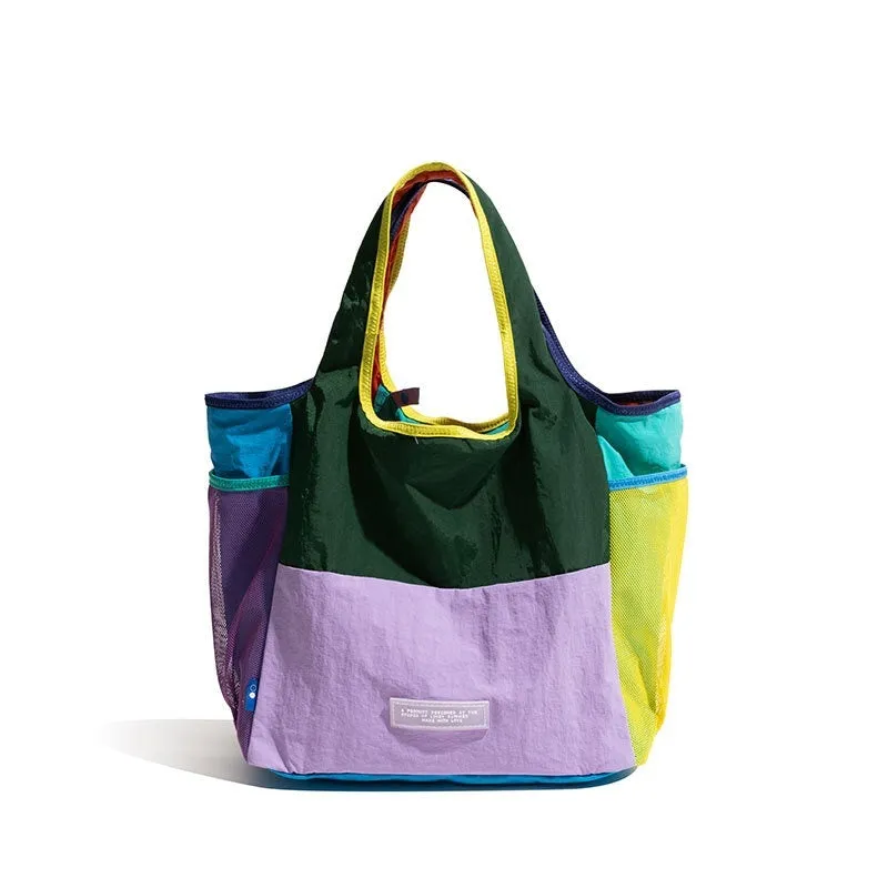 Foldable canvas tote bag in orange with crossbody strap, polyester material