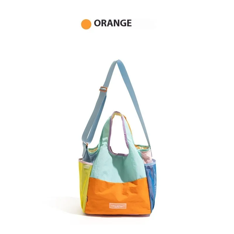 Foldable canvas tote bag in orange with crossbody strap, polyester material