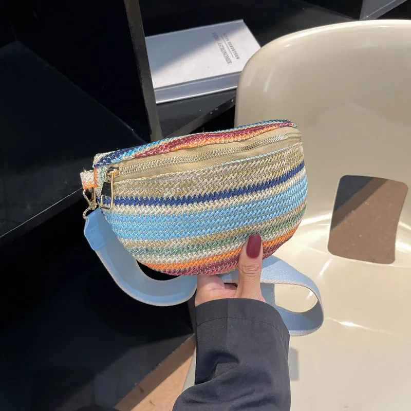 Blue Bohemian style straw beach bag with single shoulder strap and shell shape