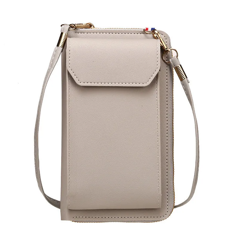 Mini crossbody phone bag for women in black PU leather with adjustable strap and sewing thread detail.