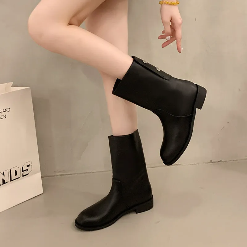 Women's black leather mid-calf platform boots with silver stud details on a white background