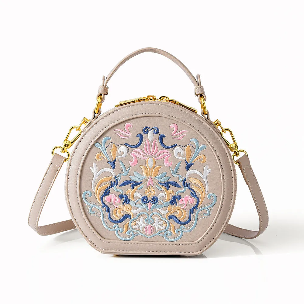 Round PU leather crossbody bag with embroidery and sewing line, available in five colours