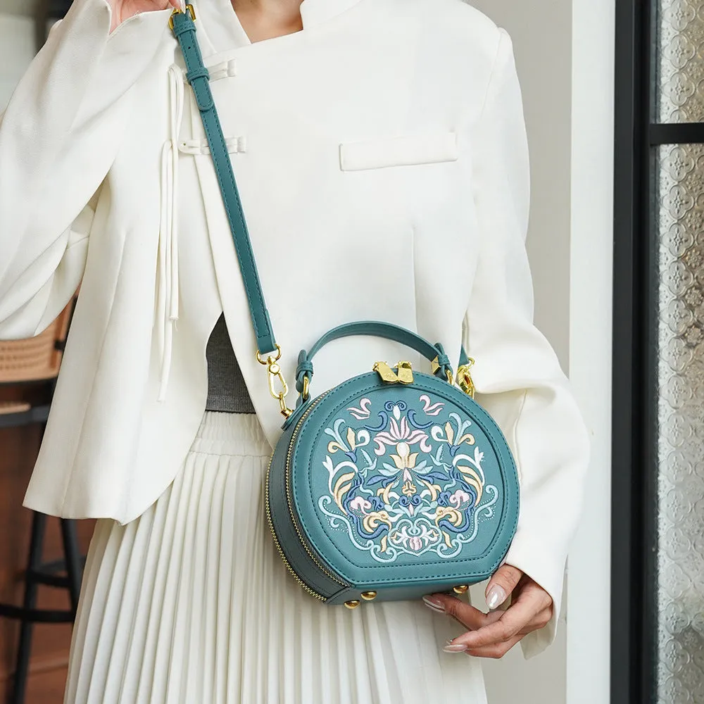 Round PU leather crossbody bag with embroidery and sewing line, available in five colours
