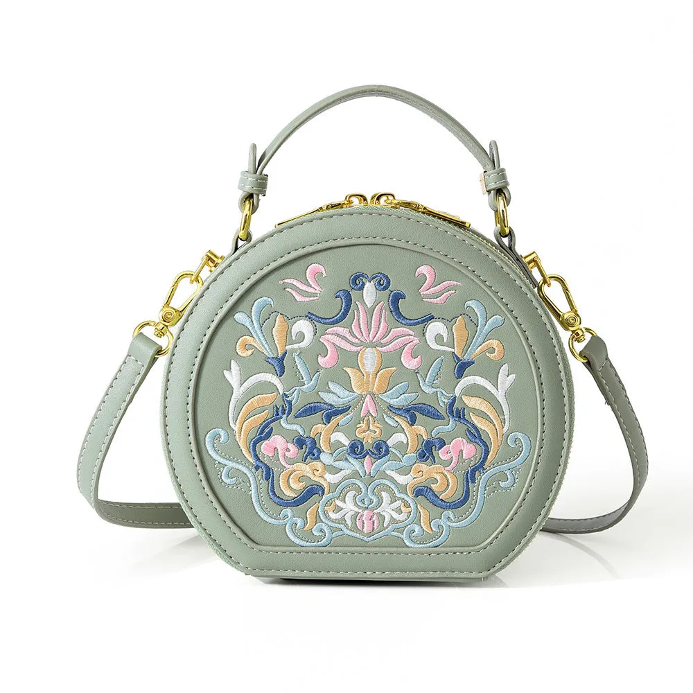 Round PU leather crossbody bag with embroidery and sewing line, available in five colours
