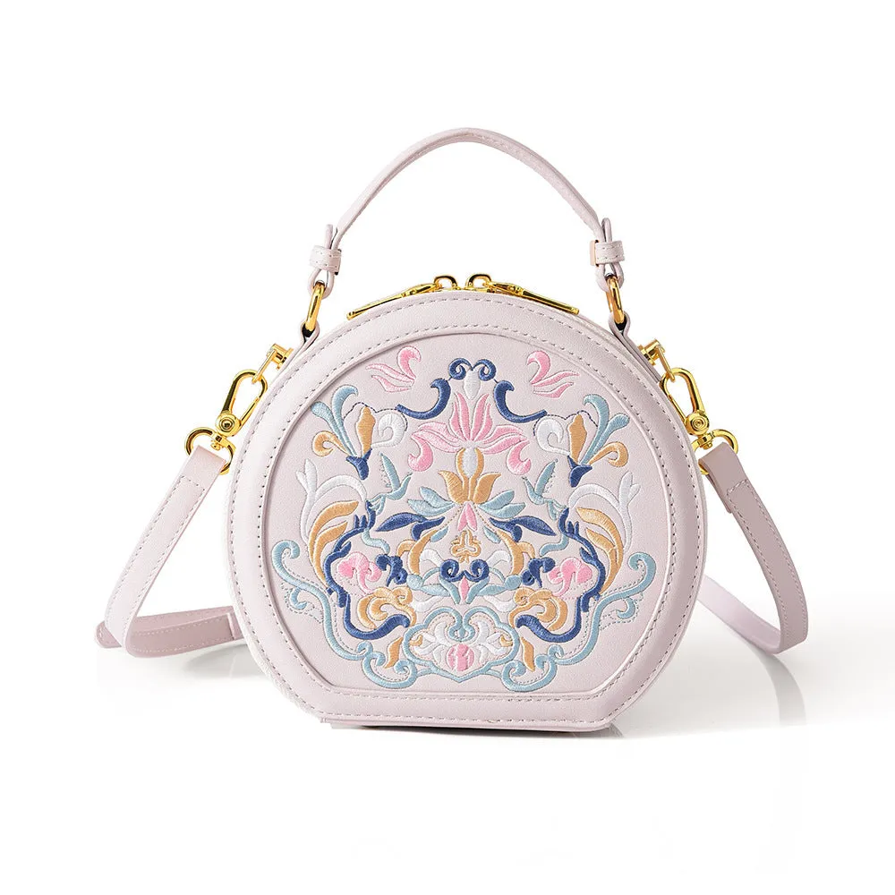 Round PU leather crossbody bag with embroidery and sewing line, available in five colours
