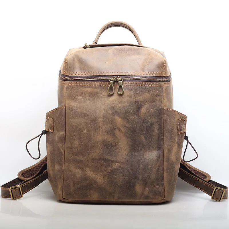 Classic retro backpack in brown Crazy Horse leather with exposed stitching and metal buckles