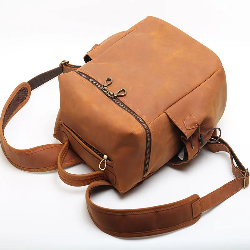 Classic retro backpack in brown Crazy Horse leather with exposed stitching and metal buckles