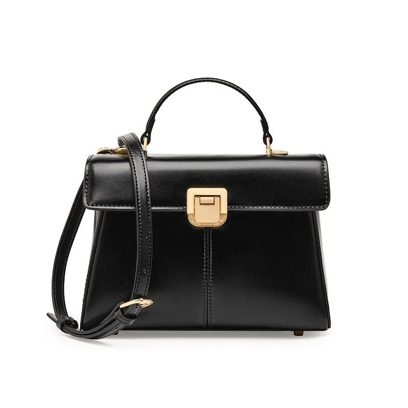Black genuine leather women's shoulder bag with clasp closure and adjustable strap.