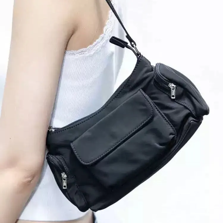 Black nylon lightweight shoulder bag with double pockets showing side line design detail