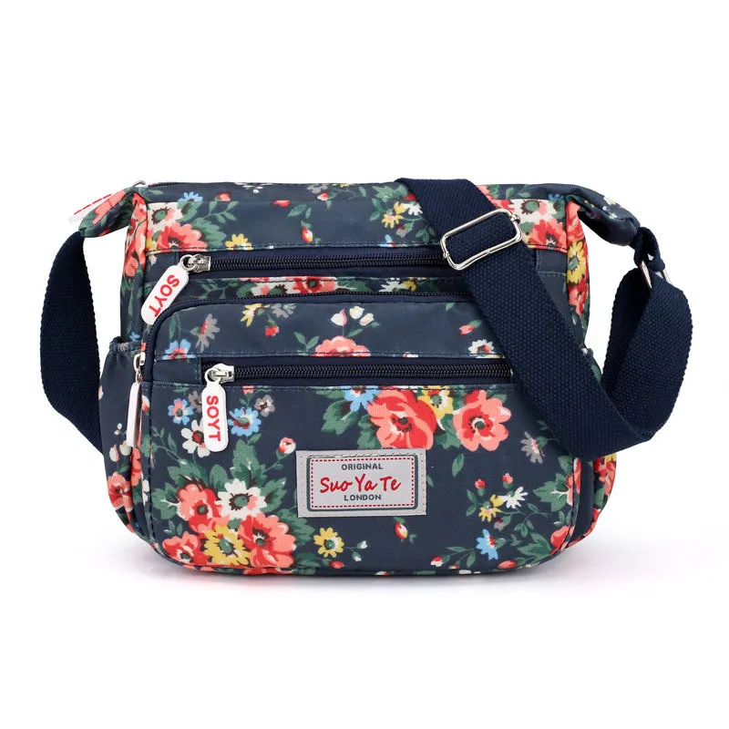 Lightweight printed nylon shoulder bag with double straps and floral or butterfly design