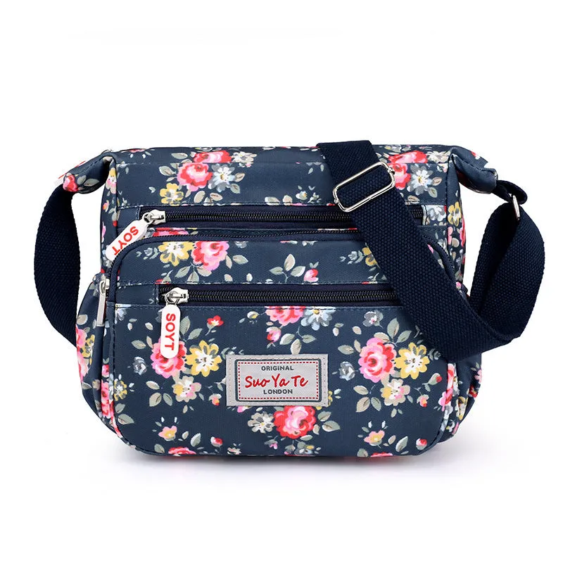 Lightweight printed nylon shoulder bag with double straps and floral or butterfly design