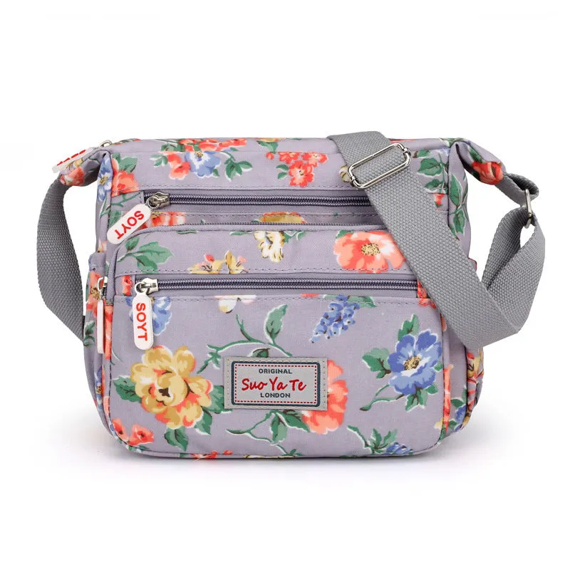 Lightweight printed nylon shoulder bag with double straps and floral or butterfly design