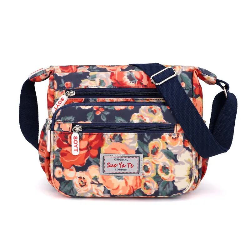 Lightweight printed nylon shoulder bag with double straps and floral or butterfly design