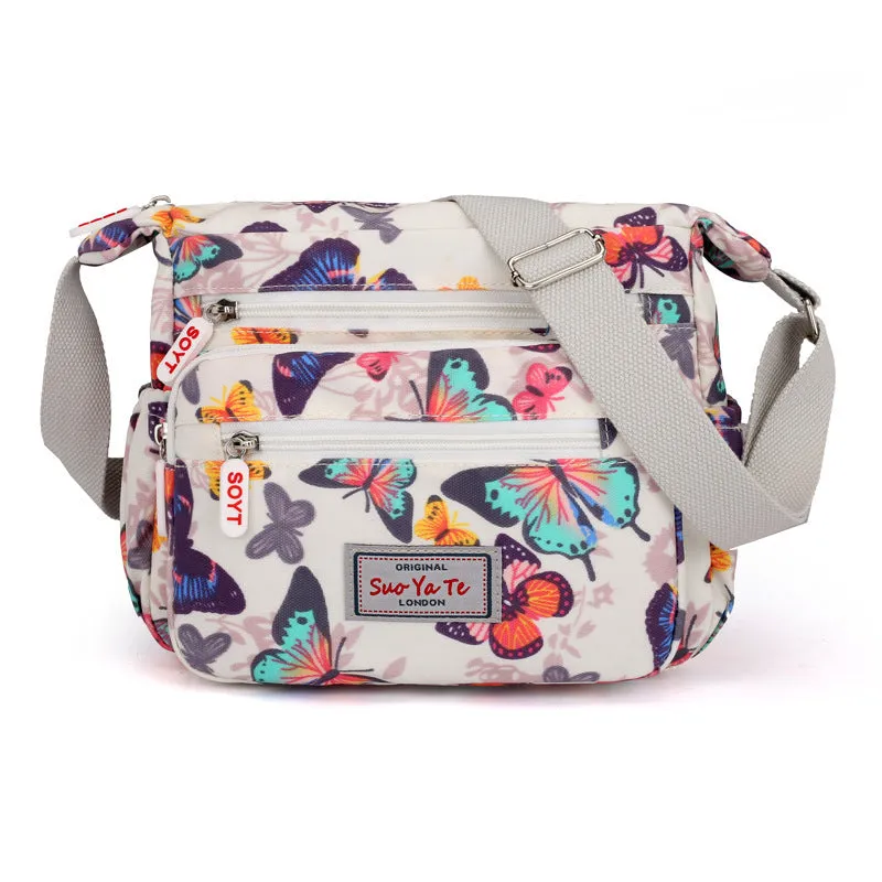 Lightweight printed nylon shoulder bag with double straps and floral or butterfly design