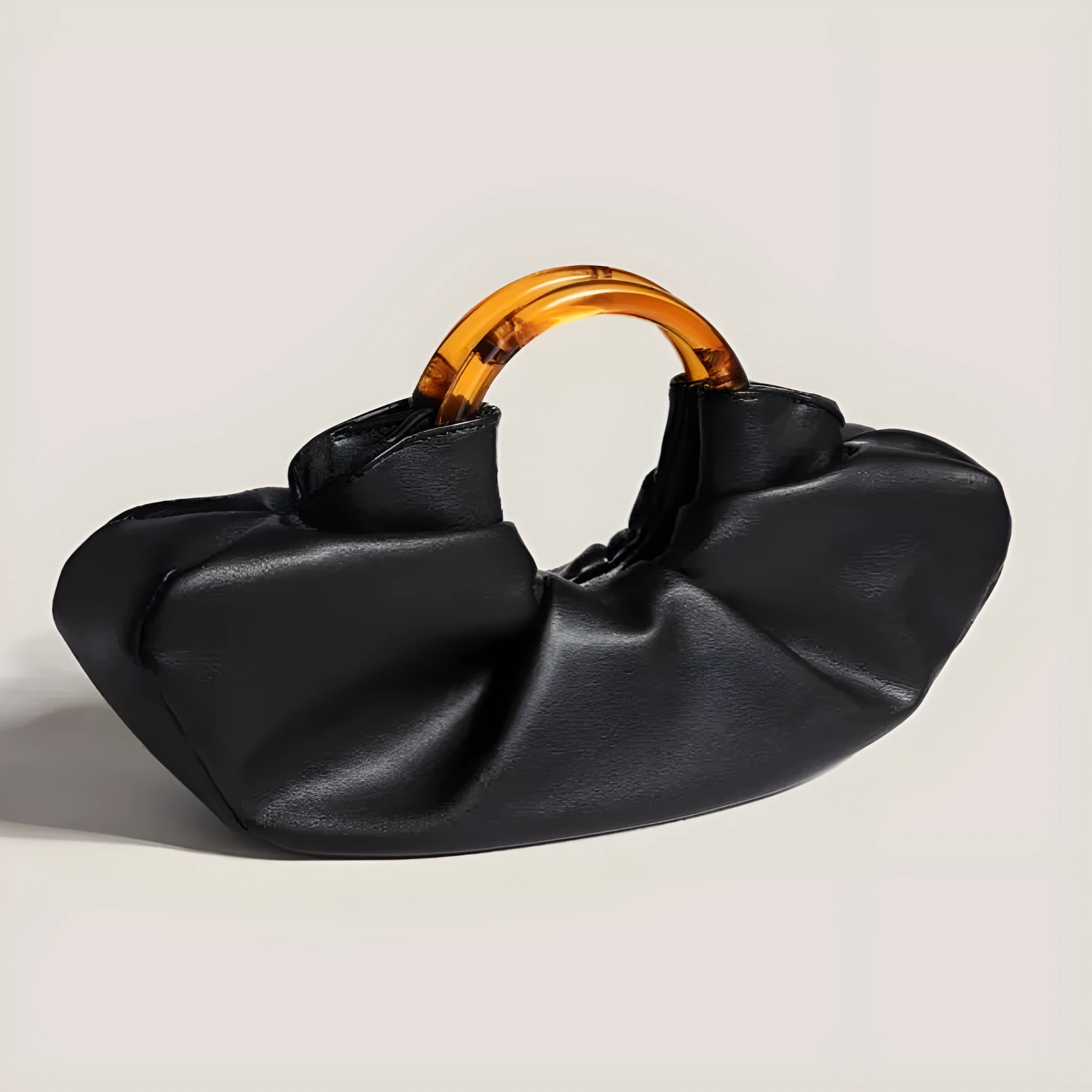Niche Horn Bag net red acrylic ring handbag in black PU leather with fold detail