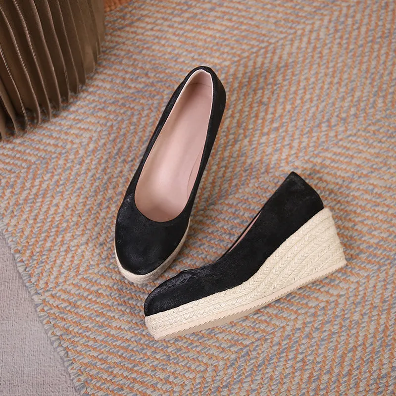 Women's apricot coloured wedge heel pumps with round toe and shallow mouth on a white background.