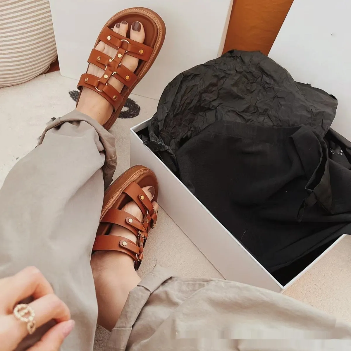 Women's white Roman sandal slippers made from sheepskin leather with patent leather finish