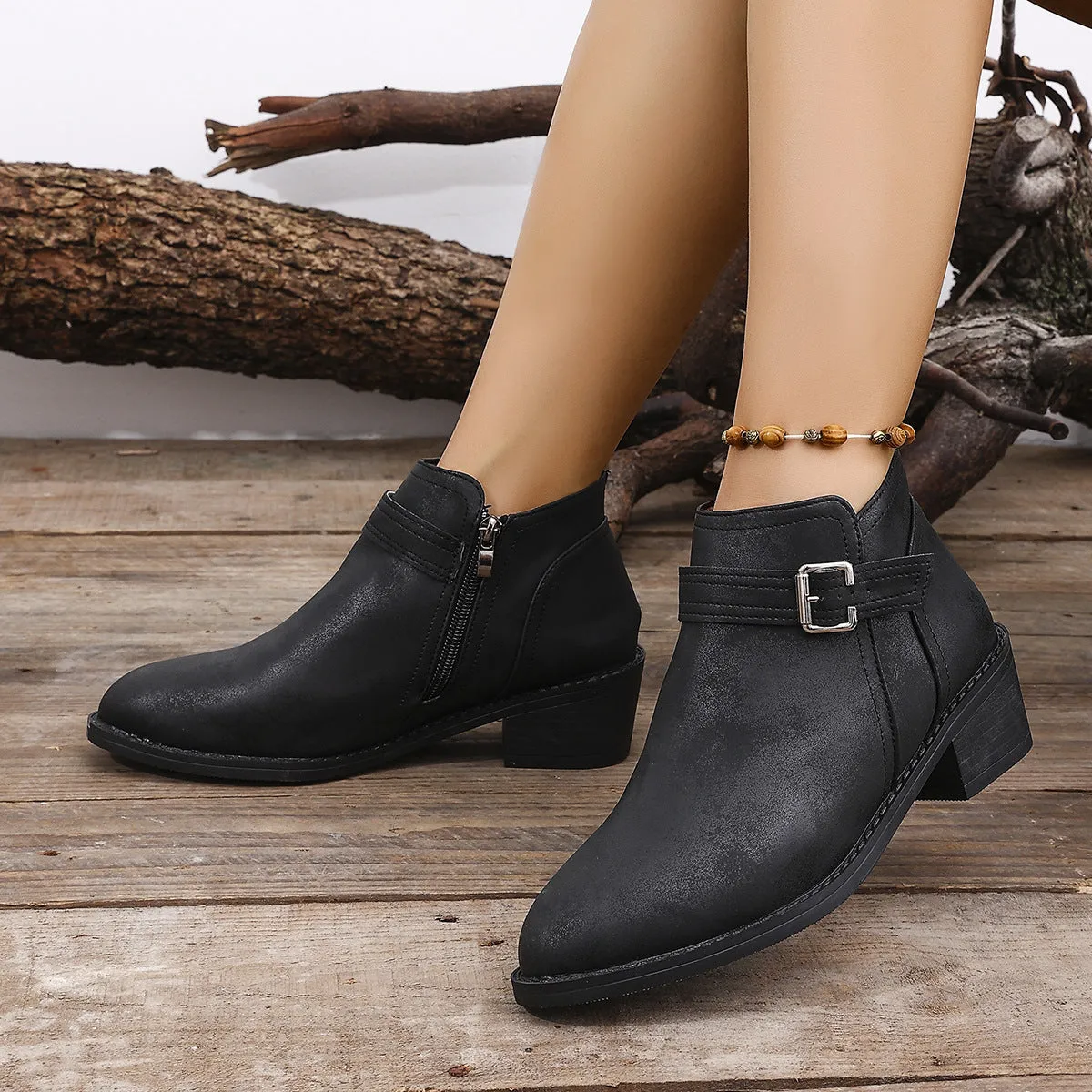 Autumn pointed female boots with chunky heel and belt buckle detail in black