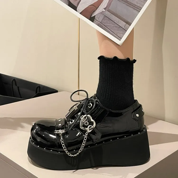 Black punk platform leather shoes with rubber sole and decorative stitching in dark lolita style
