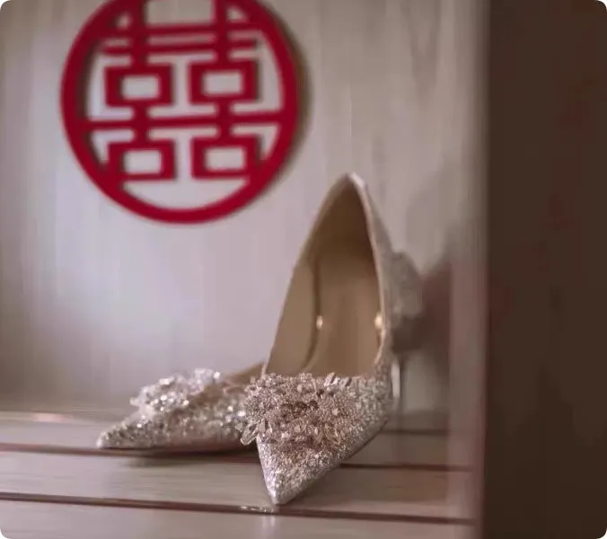 Champagne coloured bridal shoes with rhinestone crystal flower patterns and pointed toe design