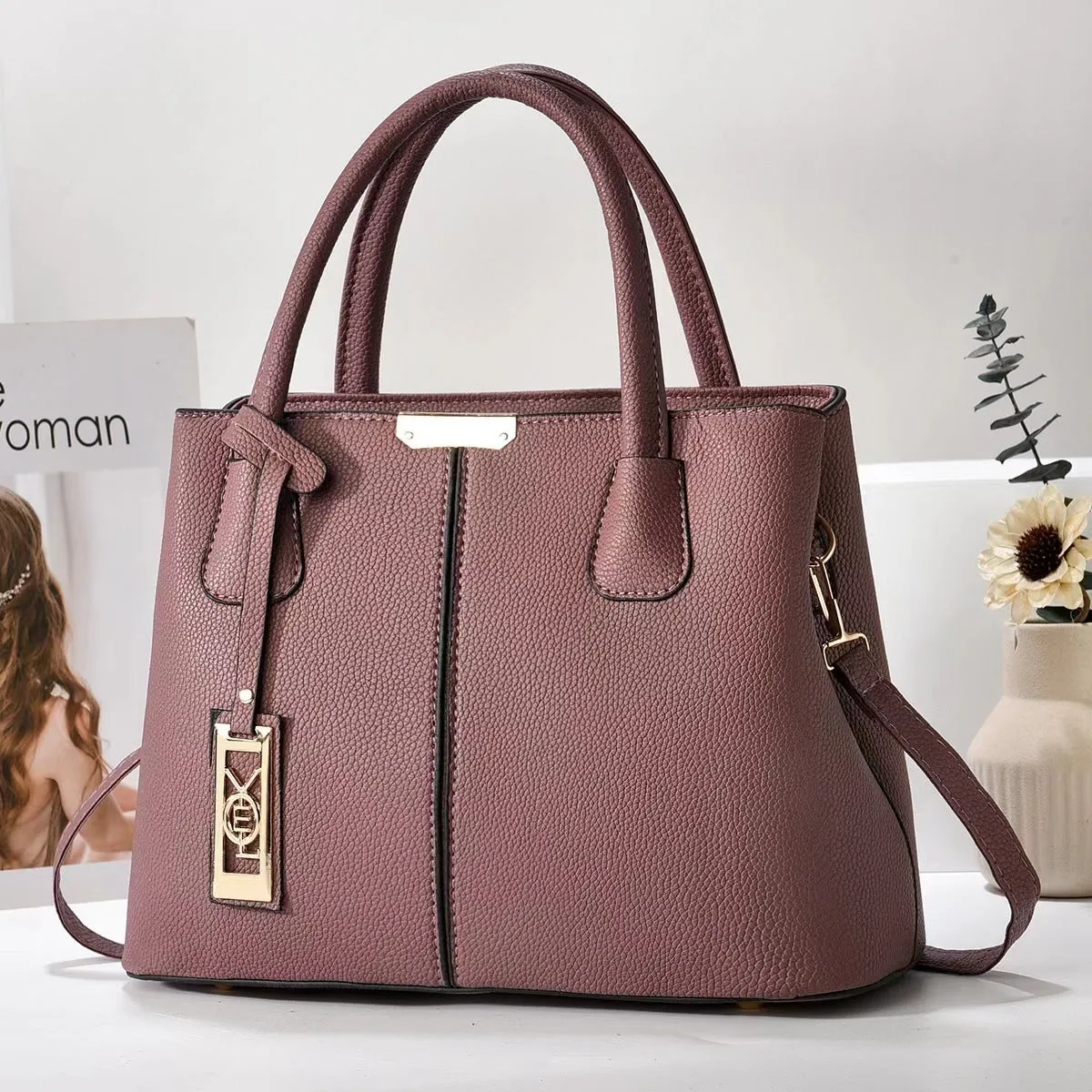 Soft PU leather large capacity shoulder bag for women in a horizontal square shape with an adjustable strap.