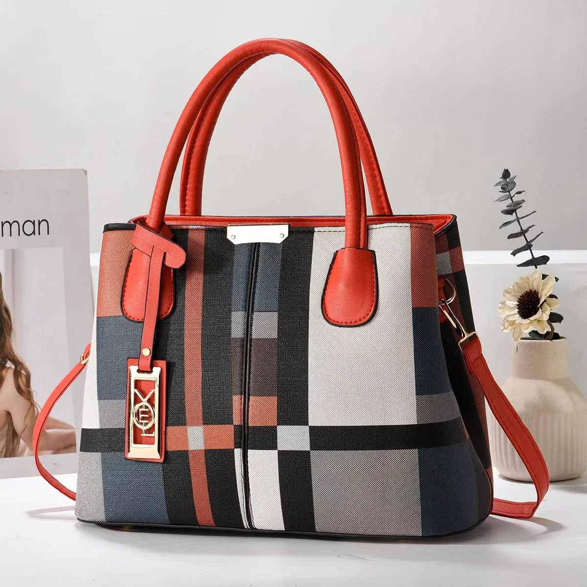 Soft PU leather large capacity shoulder bag for women in a horizontal square shape with an adjustable strap.