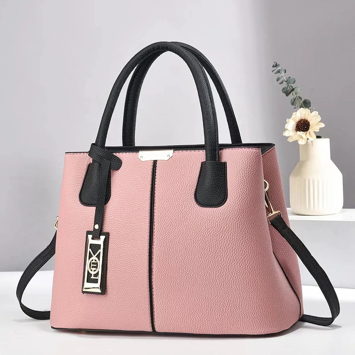 Soft PU leather large capacity shoulder bag for women in a horizontal square shape with an adjustable strap.