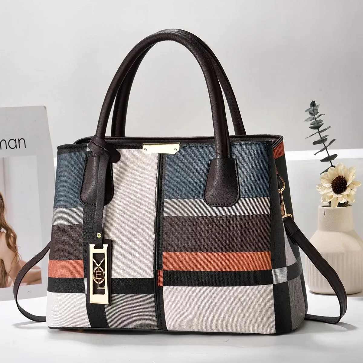 Soft PU leather large capacity shoulder bag for women in a horizontal square shape with an adjustable strap.