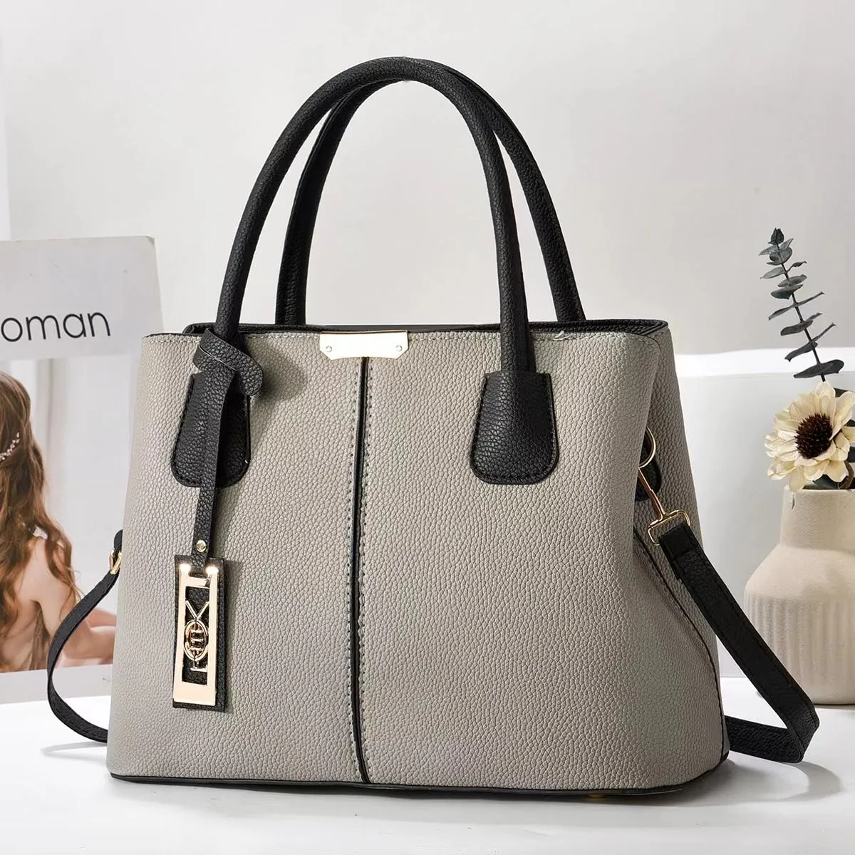 Soft PU leather large capacity shoulder bag for women in a horizontal square shape with an adjustable strap.