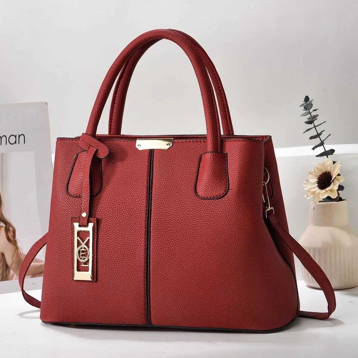 Soft PU leather large capacity shoulder bag for women in a horizontal square shape with an adjustable strap.