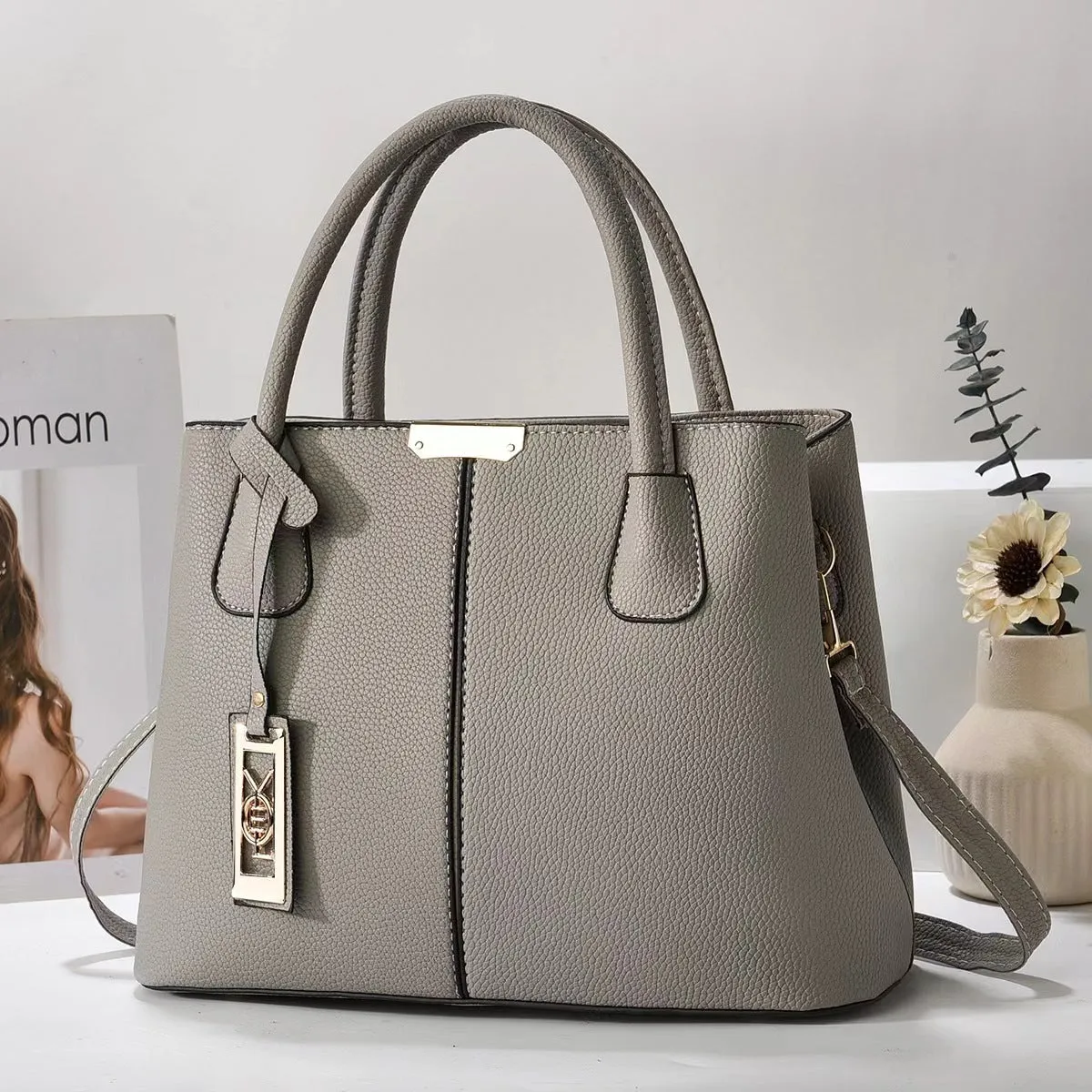 Soft PU leather large capacity shoulder bag for women in a horizontal square shape with an adjustable strap.