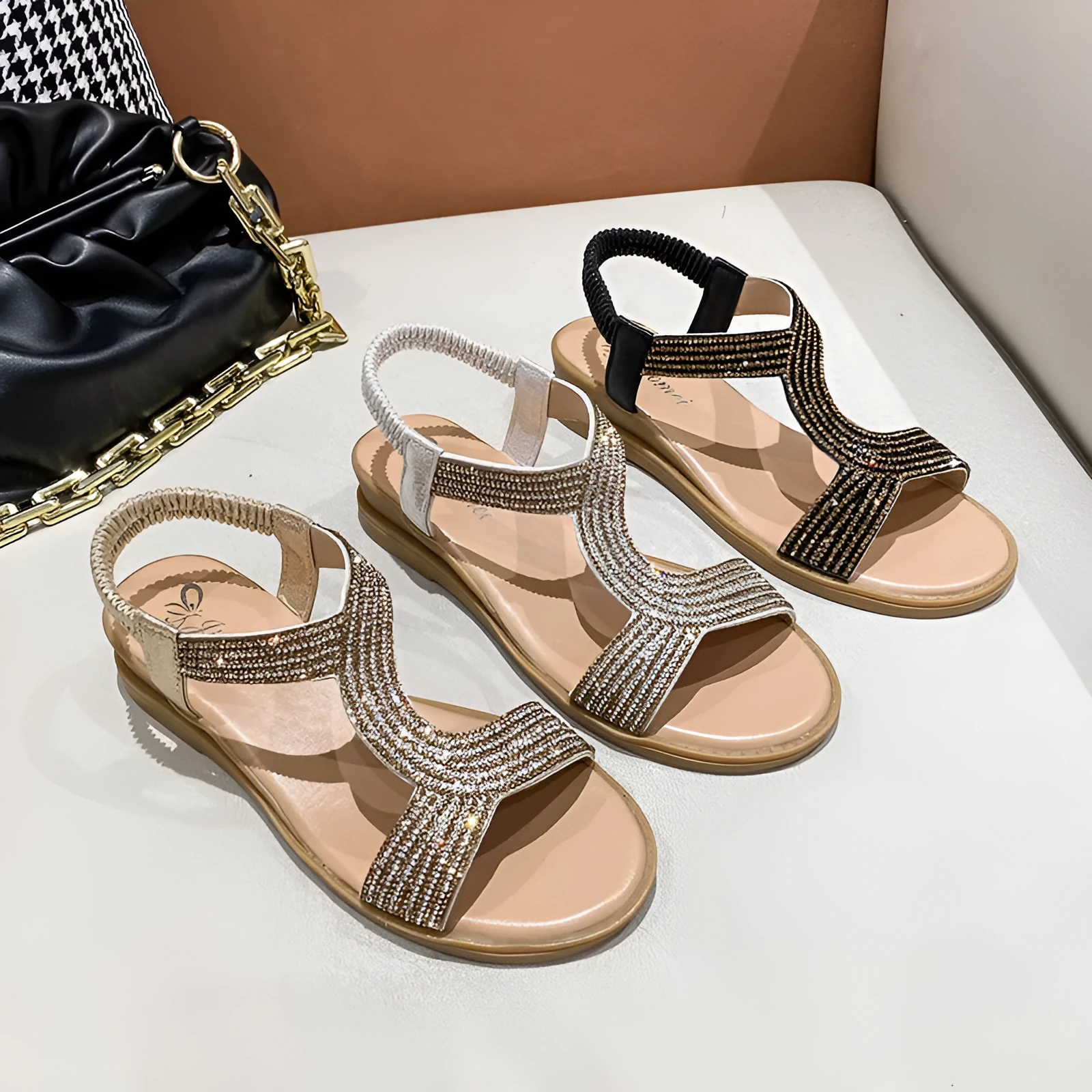 Women's glossy patent leather beach sandals with rhinestone detail on the strap.