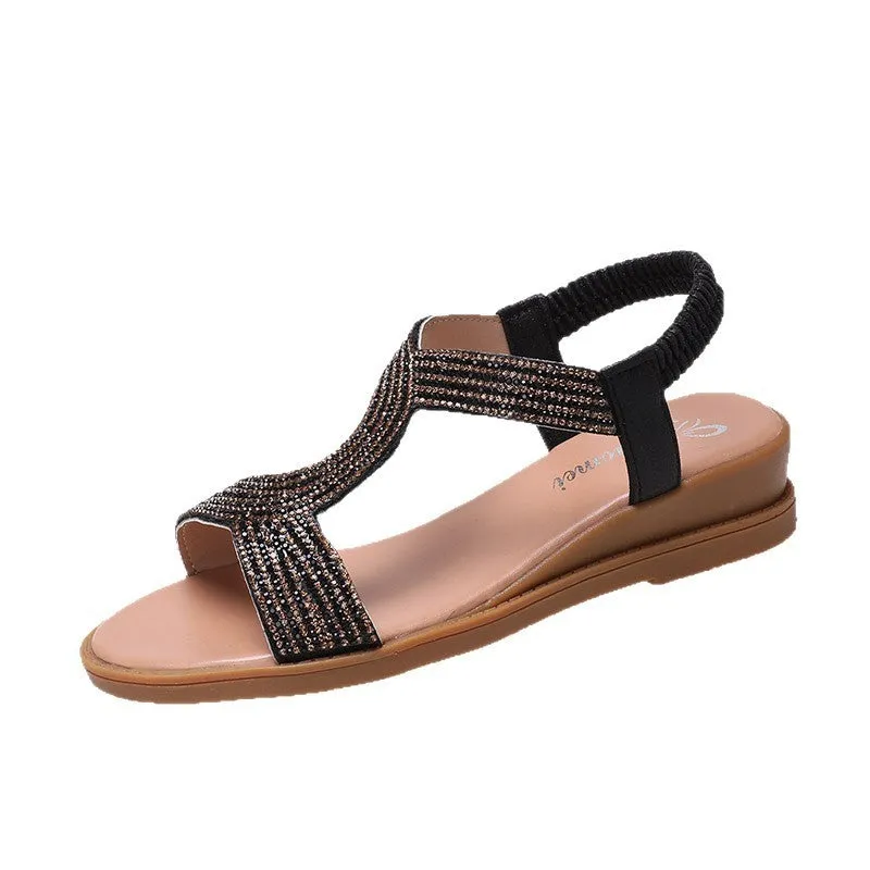 Women's glossy patent leather beach sandals with rhinestone detail on the strap.