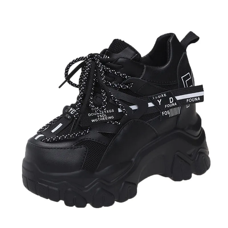 Women's white and black breathable mesh platform sports shoes with cross-strap and rubber sole.