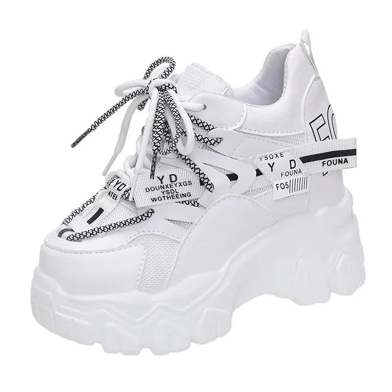 Women's white and black breathable mesh platform sports shoes with cross-strap and rubber sole.