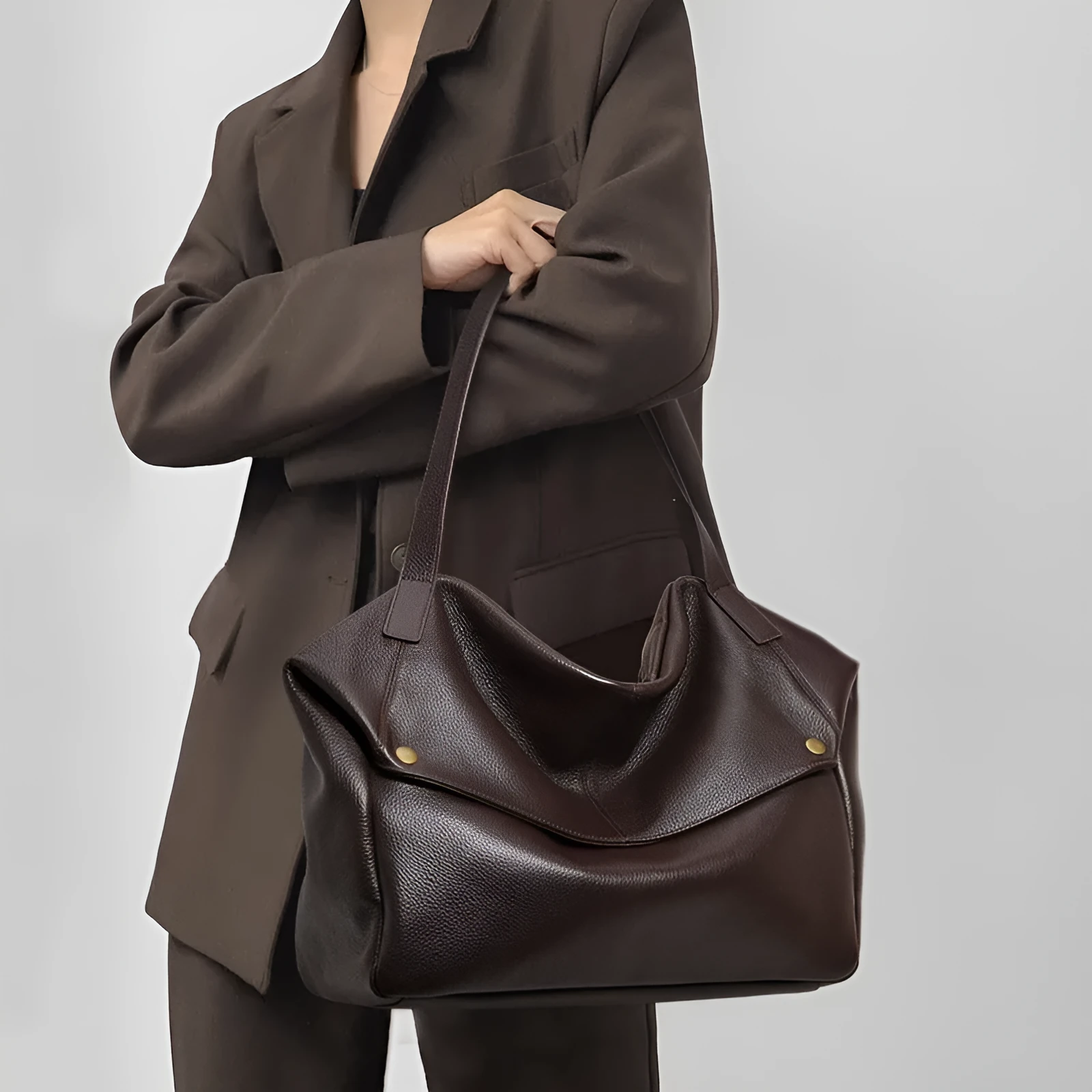 Brown genuine leather women's commuter shoulder bag with a horizontal square shape.