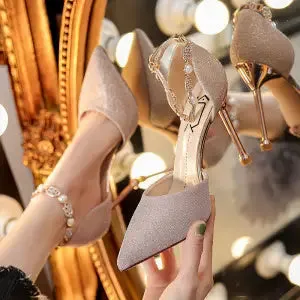 French high heel wedding shoes in silver with pointed toe, stiletto heel, and buckle closure on a clean background
