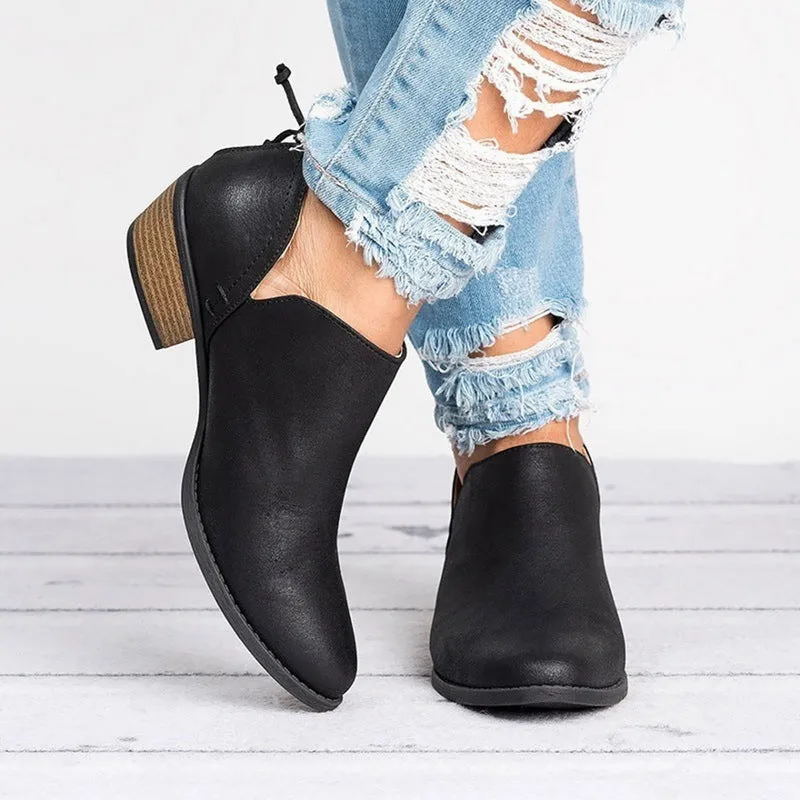 Women's butterfly-knot slip-on ankle boots in faux suede with square heel and pointed toe, available in Beige, Black, and Pink