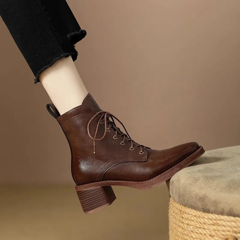 Women's black pointed-toe short boots with a 5.5cm heel and velvet finish on a neutral background.
