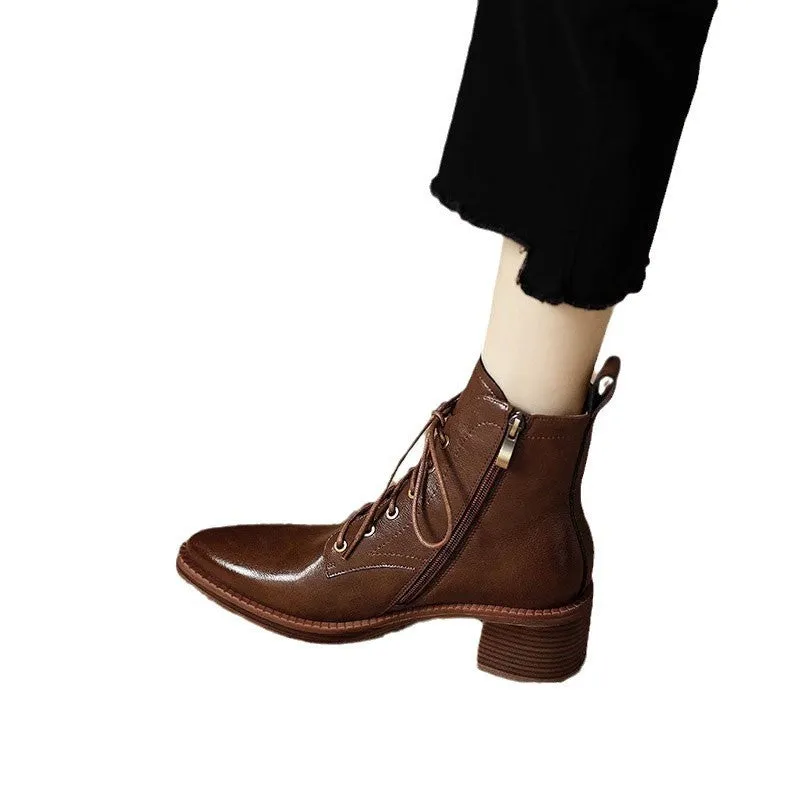 Women's black pointed-toe short boots with a 5.5cm heel and velvet finish on a neutral background.