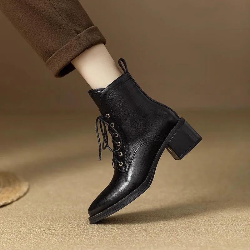 Women's black pointed-toe short boots with a 5.5cm heel and velvet finish on a neutral background.