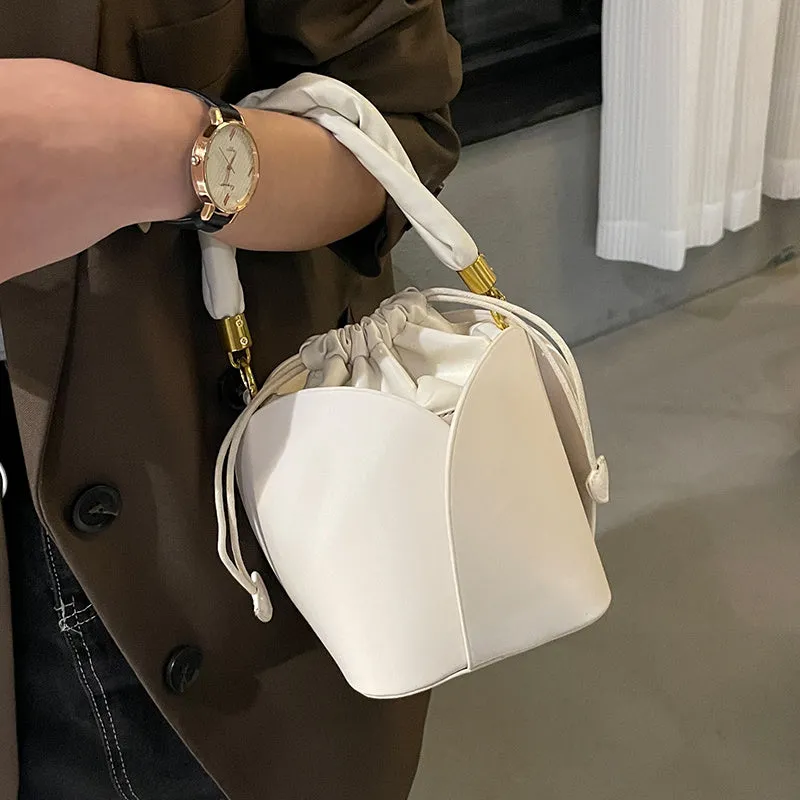 Women's small PU retro bucket bag in apricot with single shoulder strap and soft handle