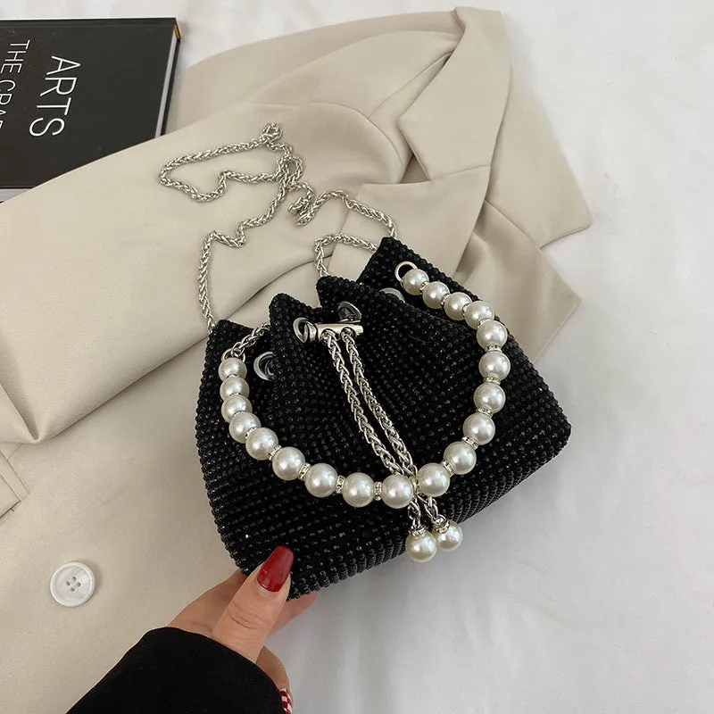 Soft PU leather crossbody bucket bag with diamond decorations and a chain shoulder strap.