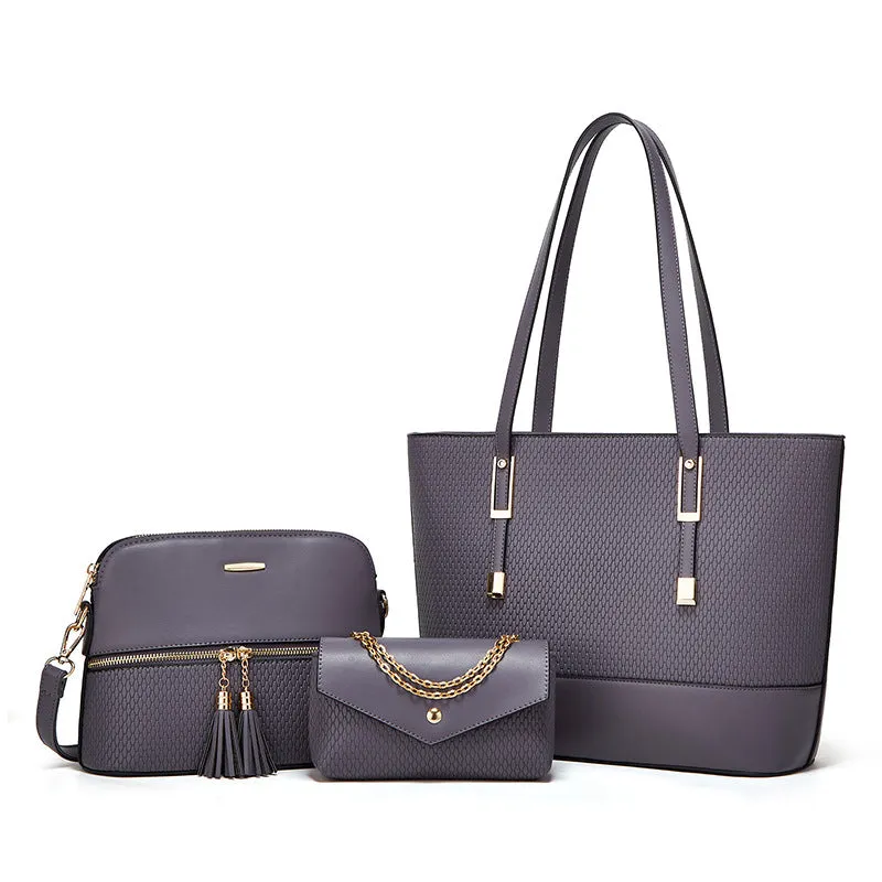 Three women's shoulder bags in black, brown, and light gray colours with folding design and PU material