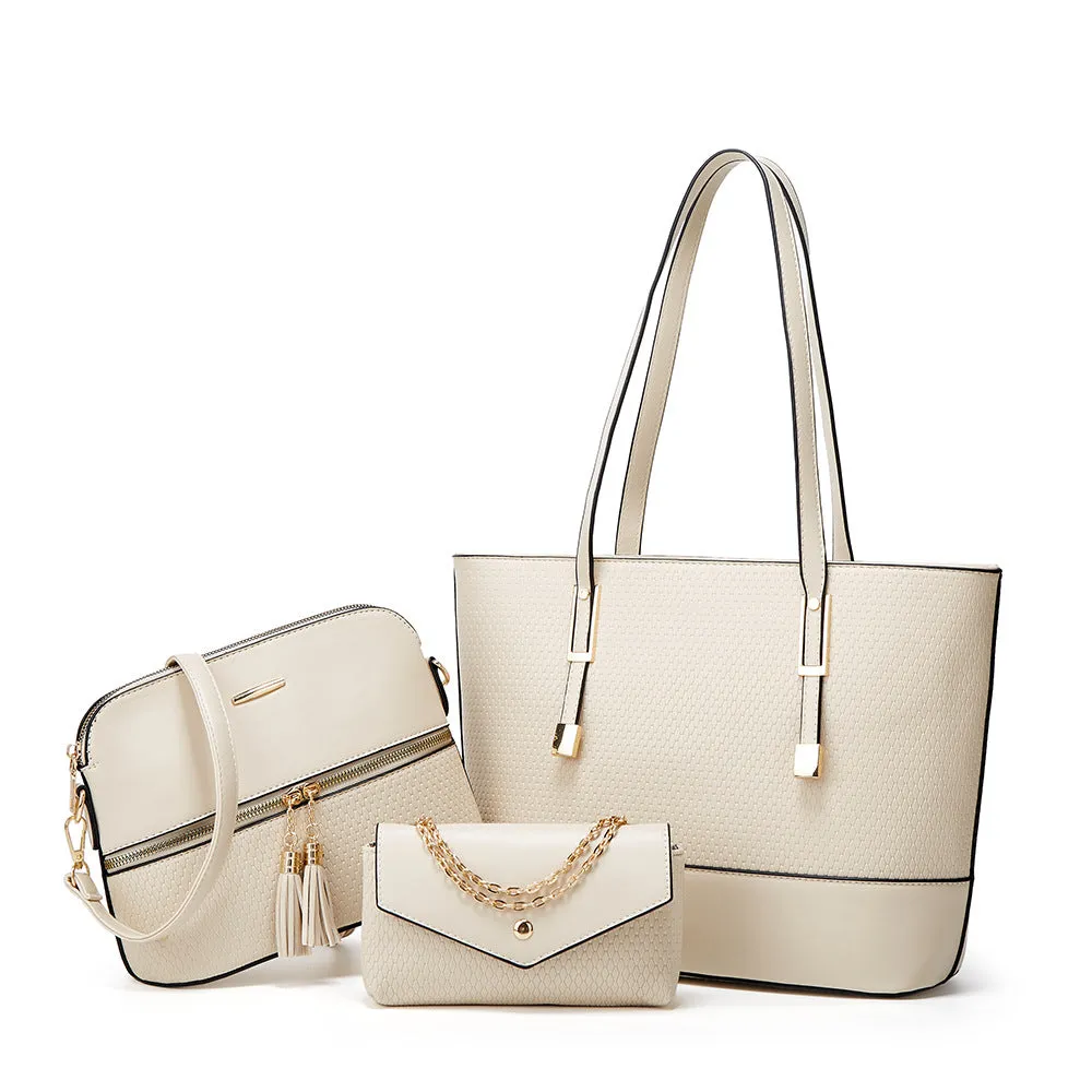 Three women's shoulder bags in black, brown, and light gray colours with folding design and PU material