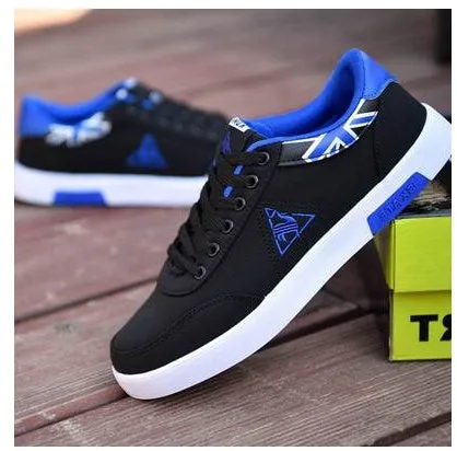 Men's Korean-style low-top canvas shoes, lace-up closure, rubber sole, plain pattern with car suture detail, available in sizes 39-44