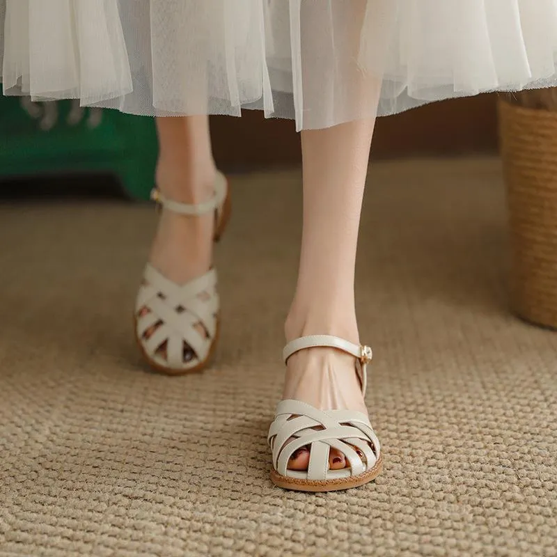 Women's flat closed toe sandals with word strap and buckle in beige colour