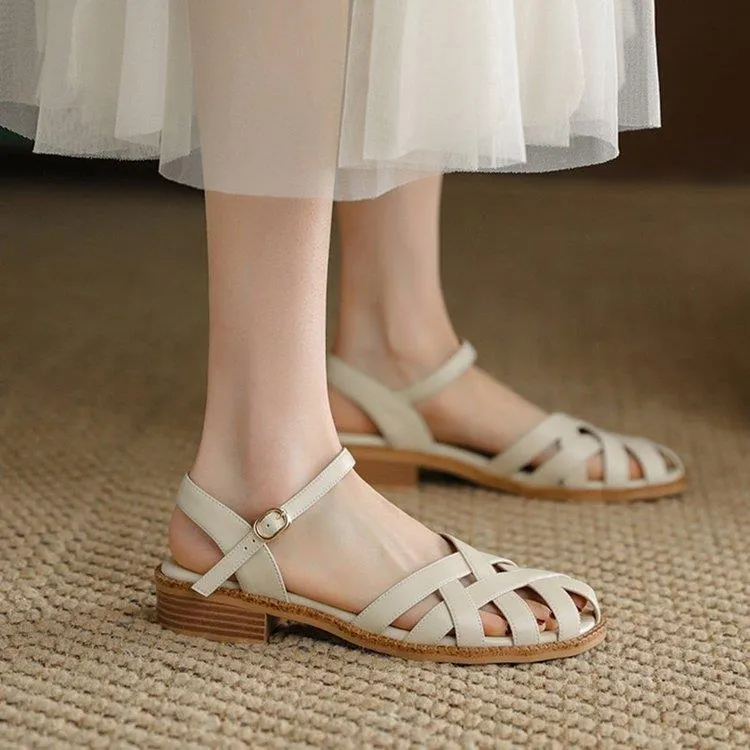 Women's flat closed toe sandals with word strap and buckle in beige colour
