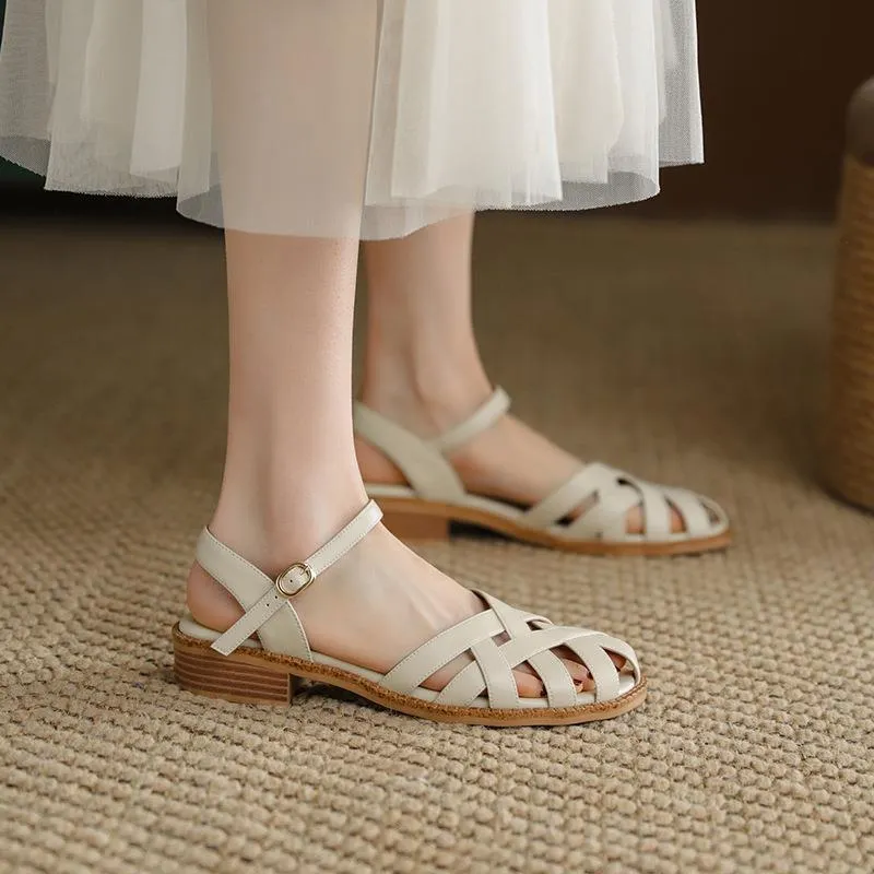 Women's flat closed toe sandals with word strap and buckle in beige colour